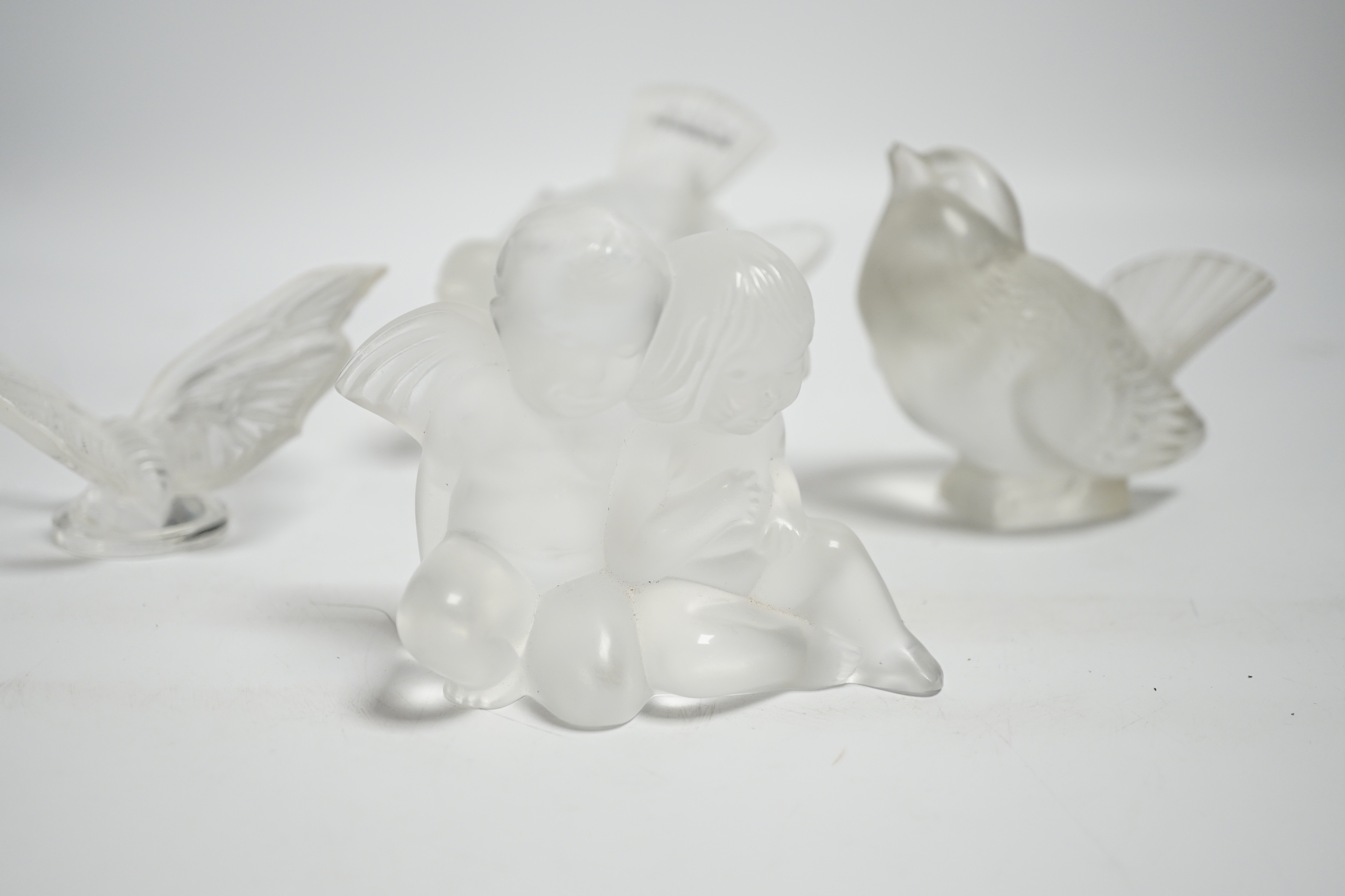 Four Lalique glass paperweights, three boxed